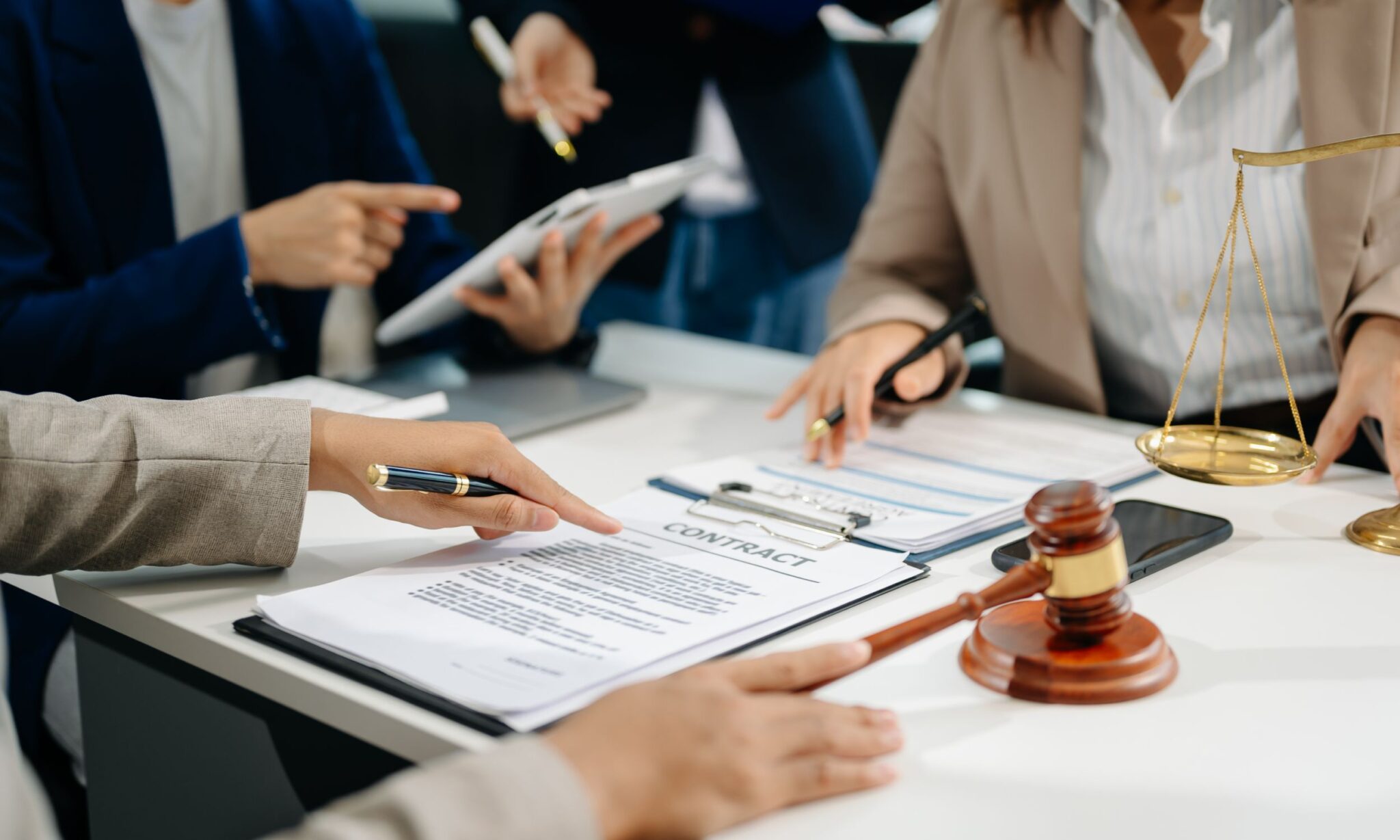 Legal team reviewing documents and contracts.