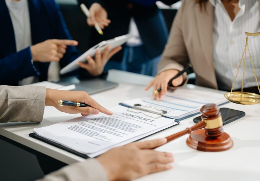 Legal team reviewing documents and contracts.