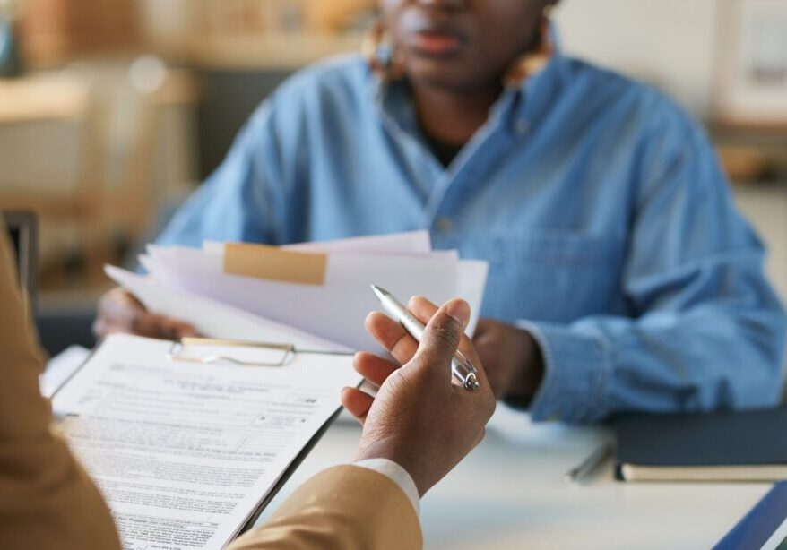 Job interview with papers and pen.